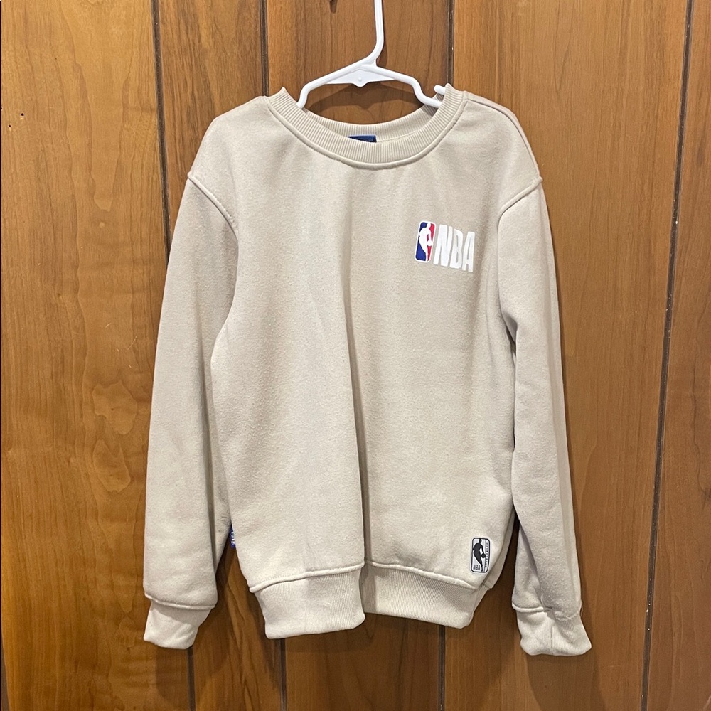 NBA Cream Apparel with Blue Tag
